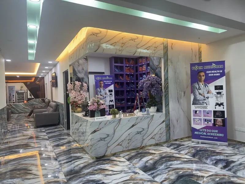 Klinik Muhibbah modern reception with floral display